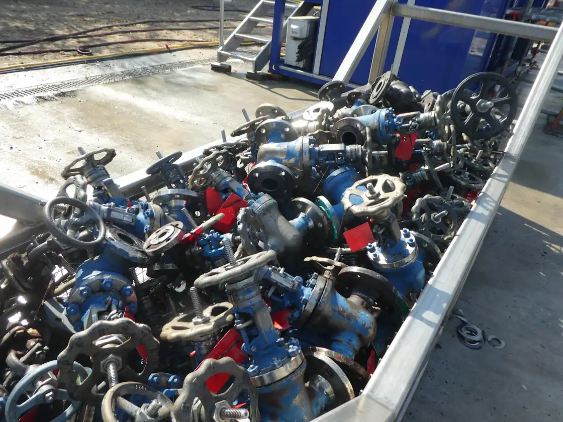Safe exchanger loading ensures secure handling of numerous valves in an industrial setting.